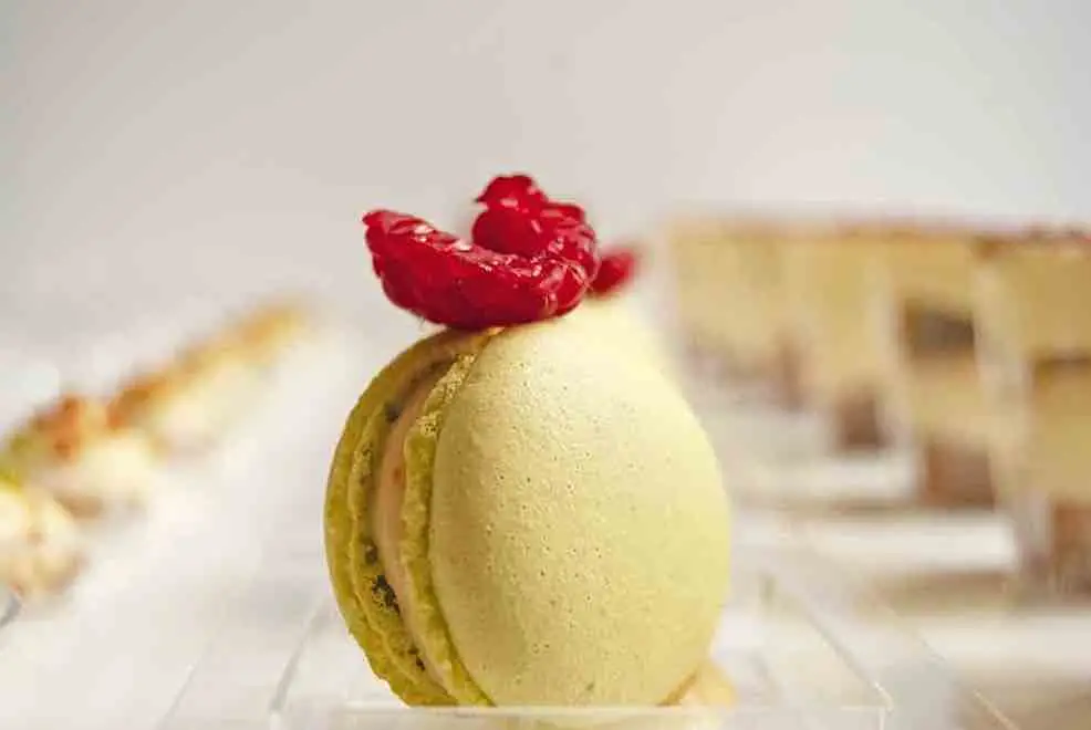 Sweet buffet piece, lemon macaron made by the chef